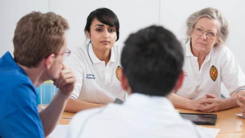 a group of physiotherapists at a table