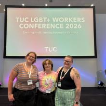 The CSP members stood together in front of a screen which has written on it 'TUC LGBT+ Workers Conference 2026'