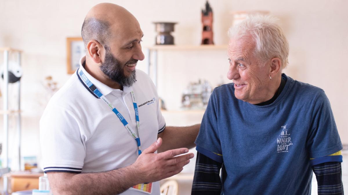 FLJul26Cover TransformingCare Senior physio Ali Shah with patient James Beaumont at a home visit [Photos: Nathan Clarke]